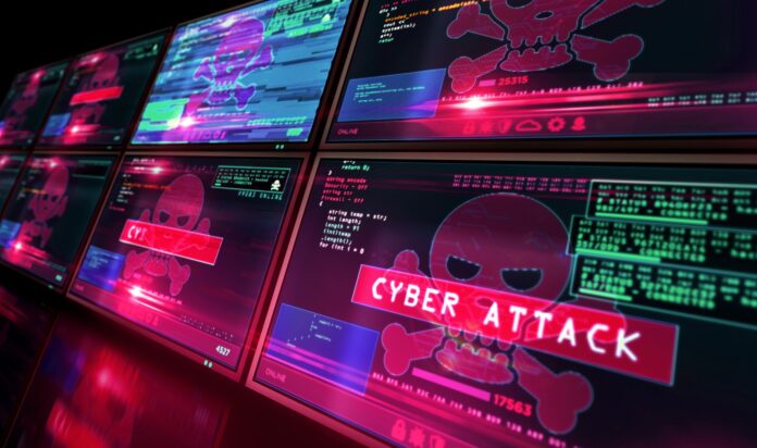 Cyberangriffe: Auf mehreren Bildschirme werden rote Totenköpfe angezeigt.