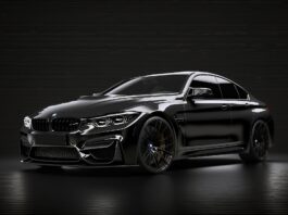 Finanzierung von Firmenfahrzeugen: Ein schwarzes Auto vor schwarzem Hintergrund